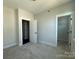 This bedroom features a doorway leading to a closet at 1227 E 34Th St # Csw0420, Charlotte, NC 28205