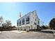 Exterior view of townhome featuring a modern facade, large windows, and well-maintained landscaping at 1227 E 34Th St # Csw0420, Charlotte, NC 28205