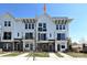 Exterior of townhome featuring large windows, modern architectural details, and inviting entryways at 1227 E 34Th St # Csw0420, Charlotte, NC 28205