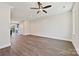 A spacious open-concept living room features sleek wood flooring, recessed lighting, and an open staircase at 1227 E 34Th St # Csw0420, Charlotte, NC 28205