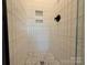 A modern shower with white vertical tiling and stylish fixtures at 1227 E 34Th St # Csw0420, Charlotte, NC 28205