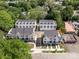 Aerial view showcasing new construction townhomes with modern architecture, private driveways, and a convenient location near amenities at 1229 E 34Th St # Csw0421, Charlotte, NC 28205