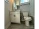 Well-lit bathroom features a classic vanity, toilet, and modern fixtures at 1229 E 34Th St # Csw0421, Charlotte, NC 28205