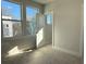 Bright bedroom with large windows showcasing the neighborhood view at 1229 E 34Th St # Csw0421, Charlotte, NC 28205