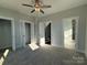 Bright bedroom with a ceiling fan, multiple closets, and easy access to the ensuite bathroom at 1229 E 34Th St # Csw0421, Charlotte, NC 28205
