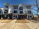 New townhomes offer brick accents, white siding, black balconies, and a modern design at 1229 E 34Th St # Csw0421, Charlotte, NC 28205