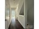 Hallway featuring wood floors, doors, and natural light at 1229 E 34Th St # Csw0421, Charlotte, NC 28205
