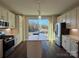 Bright kitchen with white cabinets, stainless steel appliances, and a large island overlooking the front yard at 1229 E 34Th St # Csw0421, Charlotte, NC 28205