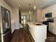 Modern kitchen with white cabinets, stainless steel appliances, quartz countertops, and a large island at 1229 E 34Th St # Csw0421, Charlotte, NC 28205