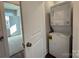 Functional laundry area features a stacked washer and dryer unit at 1229 E 34Th St # Csw0421, Charlotte, NC 28205