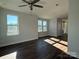 Bright living room offers plenty of natural light, wood floors, and an inviting atmosphere with a ceiling fan at 1229 E 34Th St # Csw0421, Charlotte, NC 28205