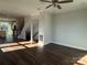 Open-concept living room with hardwood floors, a staircase, and ample natural light at 1229 E 34Th St # Csw0421, Charlotte, NC 28205