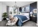 Stylish main bedroom featuring modern lighting, statement wall and large windows, and decor at 1229 E 34Th St # Csw0421, Charlotte, NC 28205