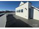 A rooftop deck with dark gray decking and white siding, providing a modern outdoor space at 1229 E 34Th St # Csw0421, Charlotte, NC 28205