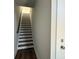 View of the home's modern stairway with dark wood treads and white risers leading to the next level at 1229 E 34Th St # Csw0421, Charlotte, NC 28205