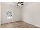 Bedroom with wood-look flooring and a window with views of the neighborhood at 1235 Ebinport Rd, Rock Hill, SC 29732