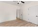 Neutral bedroom featuring wood-look flooring, ceiling fan, and ensuite bathroom entrance at 1235 Ebinport Rd, Rock Hill, SC 29732