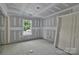 Bedroom featuring a smooth concrete floor, drywall walls, natural lighting from one window, and a single closet at 1235 Ebinport Rd, Rock Hill, SC 29732