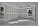 Unfinished bedroom featuring tray ceilings and natural light from windows at 1235 Ebinport Rd, Rock Hill, SC 29732