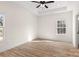 Bright bedroom with tray ceiling and two windows overlooking the backyard at 1235 Ebinport Rd, Rock Hill, SC 29732