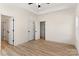 Spacious bedroom features a ceiling fan, wood-look flooring, and white trim at 1235 Ebinport Rd, Rock Hill, SC 29732
