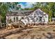 Rear view of new home under construction featuring wood deck and building wrap at 1235 Ebinport Rd, Rock Hill, SC 29732
