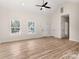 Bright living room featuring vaulted ceilings, recessed lighting, wood-look floors, and double-hung windows at 1235 Ebinport Rd, Rock Hill, SC 29732