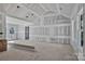 View of living room features a vaulted ceiling, drywall, and patio door access to back yard at 1235 Ebinport Rd, Rock Hill, SC 29732