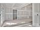 View of an open living space showcases drywall, smooth concrete floors, natural light, and recessed ceiling lights at 1235 Ebinport Rd, Rock Hill, SC 29732