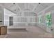 Spacious main bedroom features vaulted ceiling, drywall construction, large windows, and smooth concrete flooring at 1235 Ebinport Rd, Rock Hill, SC 29732