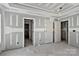Unfinished room exhibiting an open doorway and multiple interior doors at 1235 Ebinport Rd, Rock Hill, SC 29732