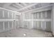 Unfinished room featuring rough drywall, doorway, and concrete floor at 1235 Ebinport Rd, Rock Hill, SC 29732