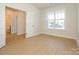 Bedroom with hardwood floors, large window, and neutral paint at 3111 Vermillion Dr, Harrisburg, NC 28075