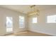 Dining room featuring hardwood floors, a modern chandelier, and natural light at 3111 Vermillion Dr, Harrisburg, NC 28075