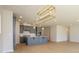 Open kitchen featuring an island, gray cabinetry, recessed lighting and a modern, decorative light fixture at 3111 Vermillion Dr, Harrisburg, NC 28075