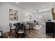 Dining area with round table and four chairs adjacent to living room at 3116 Butler Hill Dr, Matthews, NC 28105