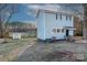 Two-story light gray house with black shutters and a detached shed at 320 Brown Rd, China Grove, NC 28023