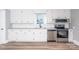 Renovated kitchen featuring white cabinets and stainless steel appliances at 320 Brown Rd, China Grove, NC 28023