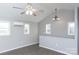 Spacious living area with vaulted ceiling, ceiling fan, and lots of natural light at 320 Brown Rd, China Grove, NC 28023