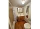 Bathroom with shower/tub combo, wood vanity, and wood floor at 34&20 Shorty Miller Rd, Taylorsville, NC 28681
