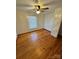 Simple bedroom with hardwood floors and a ceiling fan at 34&20 Shorty Miller Rd, Taylorsville, NC 28681