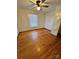 Simple bedroom with hardwood floors and a ceiling fan at 34&20 Shorty Miller Rd, Taylorsville, NC 28681