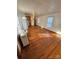 Open living area with wood floors and a view into kitchen at 34&20 Shorty Miller Rd, Taylorsville, NC 28681