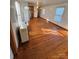 Spacious living room featuring hardwood floors and a kitchen with appliances at 34&20 Shorty Miller Rd, Taylorsville, NC 28681