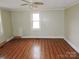 Simple bedroom with wood flooring and a window at 374 Zion Church Rd, Mount Gilead, NC 27306