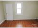 Bright bedroom featuring hardwood floors and a window at 374 Zion Church Rd, Mount Gilead, NC 27306