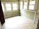 Sunlit dining area with multiple windows and tile floor at 374 Zion Church Rd, Mount Gilead, NC 27306