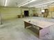 Large workshop area with workbenches and storage at 374 Zion Church Rd, Mount Gilead, NC 27306