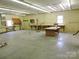Spacious workshop with multiple workbenches and cabinets at 374 Zion Church Rd, Mount Gilead, NC 27306
