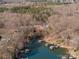 Aerial view of waterfront property with lake access and houses nearby at 3830 Mill Run, Terrell, NC 28682